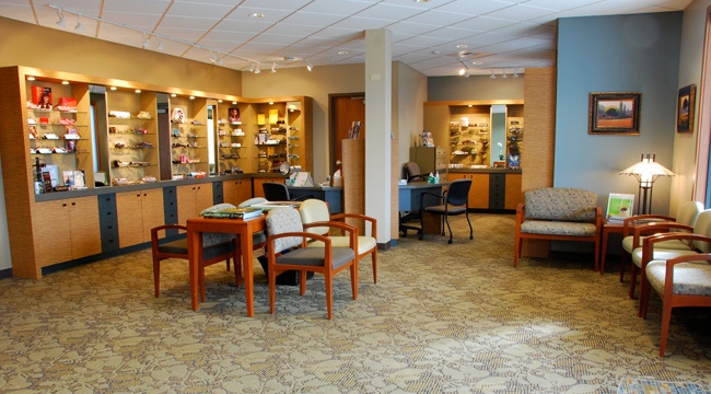 Brand Name Glasses and Frames line the wall in Bellingham Eye Physicians Optical Shop